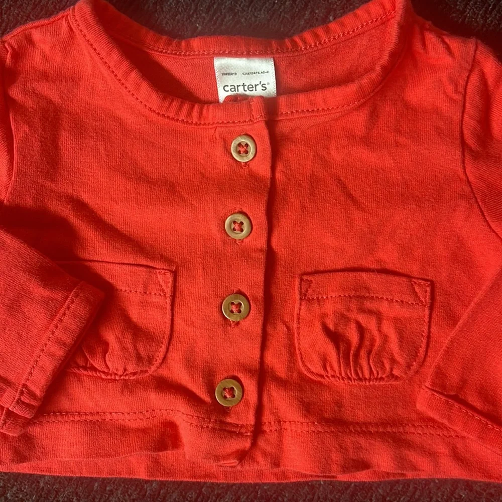 Carter’s size 3 months red long sleeve top. So cute!